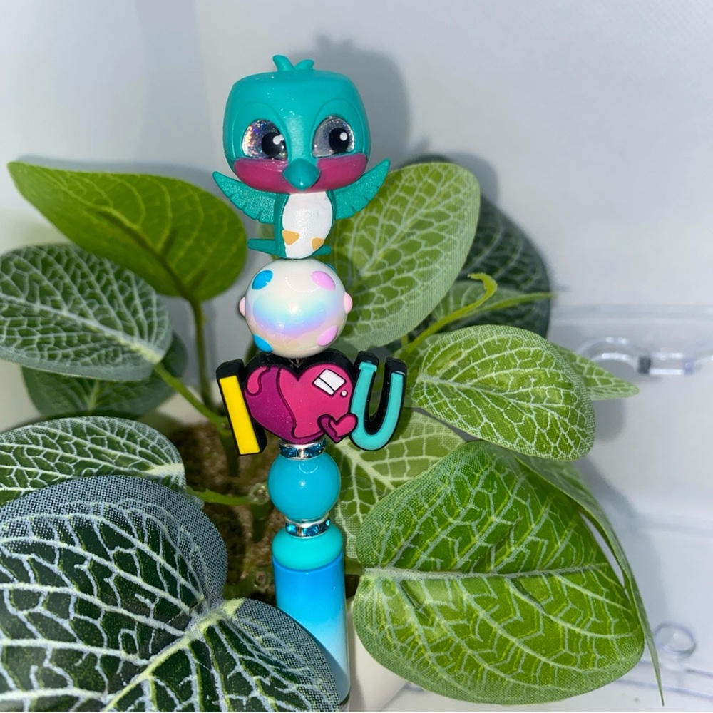 Blue and Green Bird Toy with Round Body and Large Eyes
